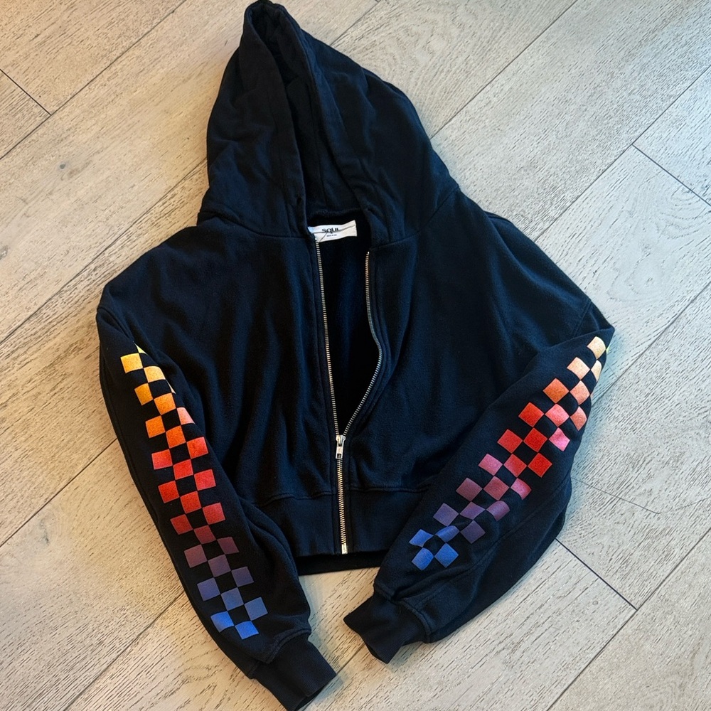 soulcycle Black Cropped Zip Hoodie with Rainbow Checkerboard Sleeves. Super cute